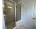 Clean bathroom with a walk-in shower and neutral tile at 1049 Bergamot Dr, Bartow, FL 33830