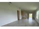 Spacious living room featuring neutral tile floors and plenty of natural light at 1049 Bergamot Dr, Bartow, FL 33830