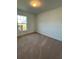 Bright bedroom with carpeted floor and large window at 2137 Emma Ln, Lake Wales, FL 33859