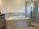 Bathroom with a large soaking tub and shower at 1218 Navel Rd, Bartow, FL 33830