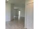 Open concept floor plan with tile flooring and access to other rooms at 1218 Navel Rd, Bartow, FL 33830