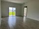 Living room with sliding glass doors leading to backyard at 1218 Navel Rd, Bartow, FL 33830