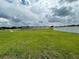 Green space with homes in the background at 1218 Navel Rd, Bartow, FL 33830