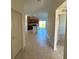 Open entryway with tile floor and views into kitchen and living areas at 1061 Bergamot Dr, Bartow, FL 33830
