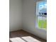 Bright bedroom with large window and carpet flooring at 1061 Bergamot Dr, Bartow, FL 33830