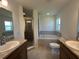 Bathroom with double vanity, garden tub, and separate shower at 1061 Bergamot Dr, Bartow, FL 33830