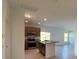 Open concept kitchen with island and stainless steel appliances at 1061 Bergamot Dr, Bartow, FL 33830