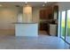 Kitchen with island, stainless steel appliances, and tile floor at 1061 Bergamot Dr, Bartow, FL 33830
