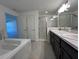 Double vanity bathroom with a large shower and garden tub at 2169 Emma Ln, Lake Wales, FL 33859