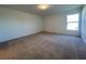 Bright and airy bedroom with neutral walls and carpeted floors at 2169 Emma Ln, Lake Wales, FL 33859