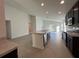 Open concept kitchen with island, stainless steel appliances, and ample counter space at 2169 Emma Ln, Lake Wales, FL 33859