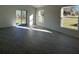 Bright and spacious living area with tile flooring and sliding glass doors leading to the backyard at 2169 Emma Ln, Lake Wales, FL 33859