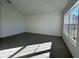 Spacious living room with large windows, tile floors, and plenty of natural light at 2169 Emma Ln, Lake Wales, FL 33859