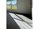 Sunlit living room featuring large windows and tile flooring at 2169 Emma Ln, Lake Wales, FL 33859