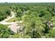 Property surrounded by tall trees with a long driveway at 213 Riverbend Rd, Ormond Beach, FL 32174