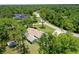 House nestled amongst lush greenery with a large lot at 213 Riverbend Rd, Ormond Beach, FL 32174