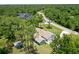 Aerial view of single-story home with a large yard and detached shed at 213 Riverbend Rd, Ormond Beach, FL 32174