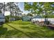 Spacious backyard with grassy area and patio furniture at 213 Riverbend Rd, Ormond Beach, FL 32174