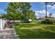 Large backyard with grassy area and camper parking at 213 Riverbend Rd, Ormond Beach, FL 32174