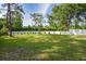 Spacious backyard with lush lawn, providing ample outdoor space at 213 Riverbend Rd, Ormond Beach, FL 32174