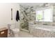 Updated bathroom with walk-in shower, soaking tub, and modern vanity at 213 Riverbend Rd, Ormond Beach, FL 32174