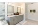 Double vanity bathroom with gray cabinets and quartz countertops at 213 Riverbend Rd, Ormond Beach, FL 32174