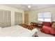 Well-lit bedroom with built-in closet and sitting area at 213 Riverbend Rd, Ormond Beach, FL 32174