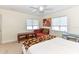 Spacious bedroom featuring two windows and a sitting area at 213 Riverbend Rd, Ormond Beach, FL 32174