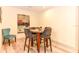 Bright breakfast nook with table and four chairs, ideal for a quick meal at 213 Riverbend Rd, Ormond Beach, FL 32174