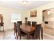 Formal dining room featuring a large wooden table and six chairs at 213 Riverbend Rd, Ormond Beach, FL 32174