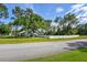 House exterior showcasing a well-maintained lawn and white fence at 213 Riverbend Rd, Ormond Beach, FL 32174