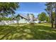Charming light teal house with stone accents and a spacious yard at 213 Riverbend Rd, Ormond Beach, FL 32174