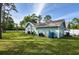 View of the house's exterior and surrounding yard at 213 Riverbend Rd, Ormond Beach, FL 32174