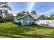 Exterior view of the house and detached shed at 213 Riverbend Rd, Ormond Beach, FL 32174