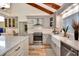Updated kitchen with gray cabinets, white quartz countertops, and farmhouse sink at 213 Riverbend Rd, Ormond Beach, FL 32174
