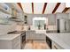 Modern kitchen with gray cabinets, stainless steel appliances, and a large island at 213 Riverbend Rd, Ormond Beach, FL 32174