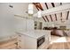 Open concept kitchen with white island, gray cabinets, and high ceilings at 213 Riverbend Rd, Ormond Beach, FL 32174