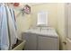 Laundry room with washer, dryer, and shelving at 213 Riverbend Rd, Ormond Beach, FL 32174