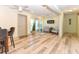 Spacious living room with wood floors and ample natural light at 213 Riverbend Rd, Ormond Beach, FL 32174