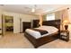 Main bedroom with king-size bed, dresser, and walk-in closet at 213 Riverbend Rd, Ormond Beach, FL 32174