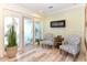 Cozy sitting area with two armchairs and a fireplace at 213 Riverbend Rd, Ormond Beach, FL 32174