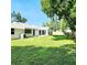 Large grassy backyard with mature trees offers plenty of space at 210 W Illiana St, Orlando, FL 32806