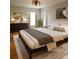 Spacious bedroom with king-size bed, wood floors, and large windows at 210 W Illiana St, Orlando, FL 32806
