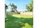 Expansive backyard with grassy lawn and wooden fence at 210 W Illiana St, Orlando, FL 32806