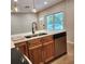 Eat-in kitchen with island, stainless steel appliances, and wood cabinets at 210 W Illiana St, Orlando, FL 32806