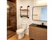 Modern bathroom with a glass shower, new toilet and vanity at 210 W Illiana St, Orlando, FL 32806