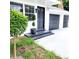 Modern black front door and two-car garage at 210 W Illiana St, Orlando, FL 32806