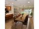 Bright dining room with long wooden table and modern lighting at 210 W Illiana St, Orlando, FL 32806