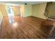 Hardwood floor living room with access to kitchen and stairs at 1019 Grove St # 85, Maitland, FL 32751