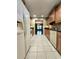 Kitchen with granite countertops, white appliances, and view to dining room at 1019 Grove St # 85, Maitland, FL 32751